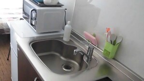 A modern kitchen with a stainless steel sink, a built-in microwave, and a digital oven control panel. - KyotoHouseToji (Kyoto)