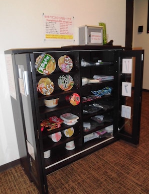 Convenient vending machine offering a range of snacks and essentials.