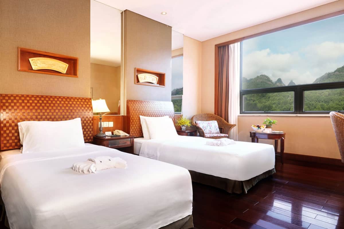 deluxe twin room, mountain view | minibar, in-room safe, desk, blackout curtains