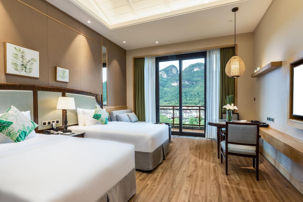 twin room | minibar, in-room safe, desk, blackout curtains