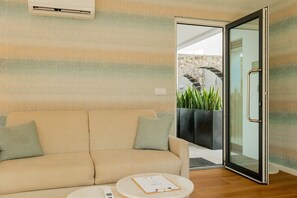 Family Suite, 2 Bedrooms, Kitchenette | Living area | 32-inch flat-screen TV with digital channels, TV, toys - Casa do Contador - Suites & Pool (Ponta Delgada)