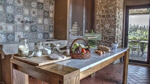 A kitchen area with a marble countertop, a stone wall, and a sign reading "Cooking Class". - Salvadonica - Borgo del Chianti (San Casciano in Val di Pesa)