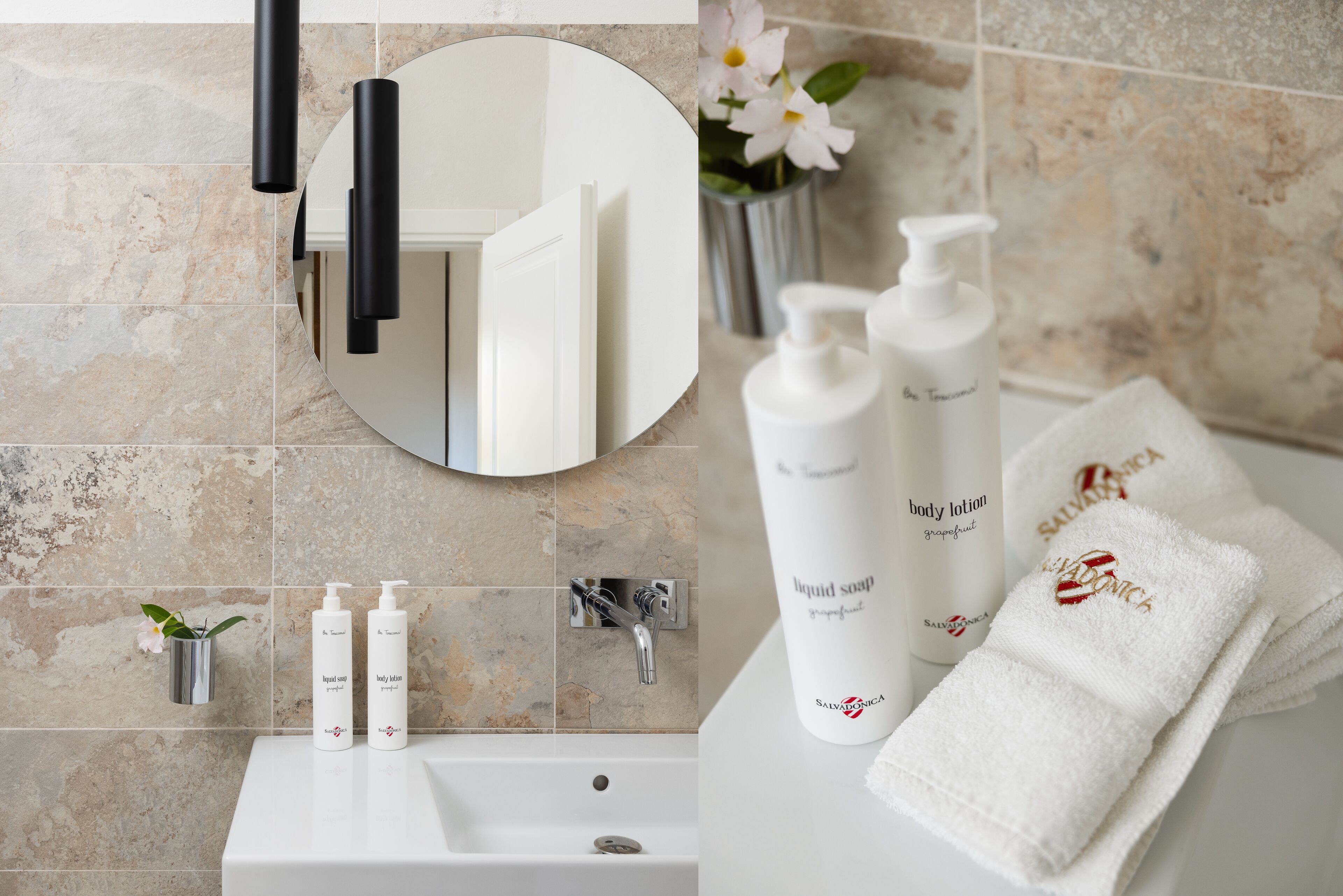 A bathroom with a bathtub, two bottles of body lotion, a bottle of liquid soap, and a towel with a logo.