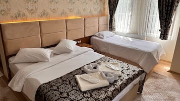 Family Room | Premium bedding, individually decorated, desk, iron/ironing board