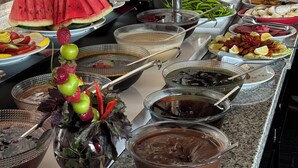 A buffet with various food items and a salad bar. - Grand Hotel Van (Van)
