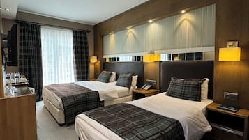 Standard Triple Room | Minibar, in-room safe, desk, soundproofing