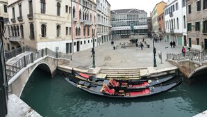 A canal with gondolas, a bridge, and historic buildings. - 40.17 San Marco (Venice)