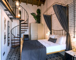 Suite junior | Ropa de cama de alta calidad, minibar, decoración individual