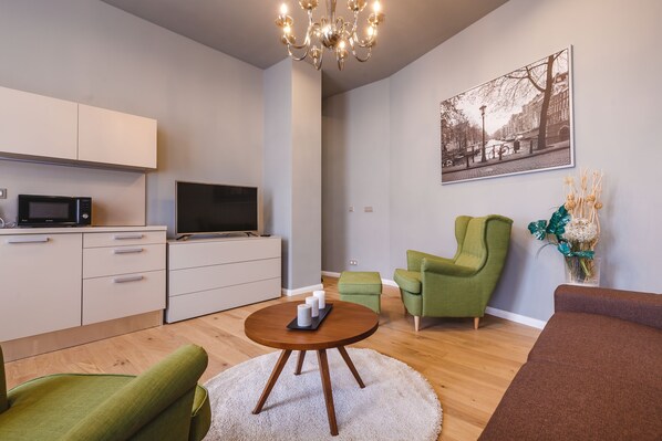 Premium Apartment, 1 Bedroom, Kitchenette, River View (55 sqm) | Living area | 110-cm flat-screen TV with satellite channels, TV