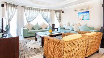 65-inch flat-screen TV with satellite channels, TV, Netflix
