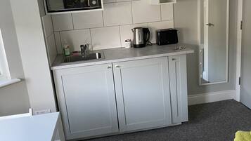 Executive Double Room | Private kitchenette | Full-sized fridge, microwave, electric kettle, toaster