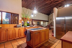Entire Lodge Ulwazi | Private kitchen | Full-size fridge, microwave, oven, stovetop