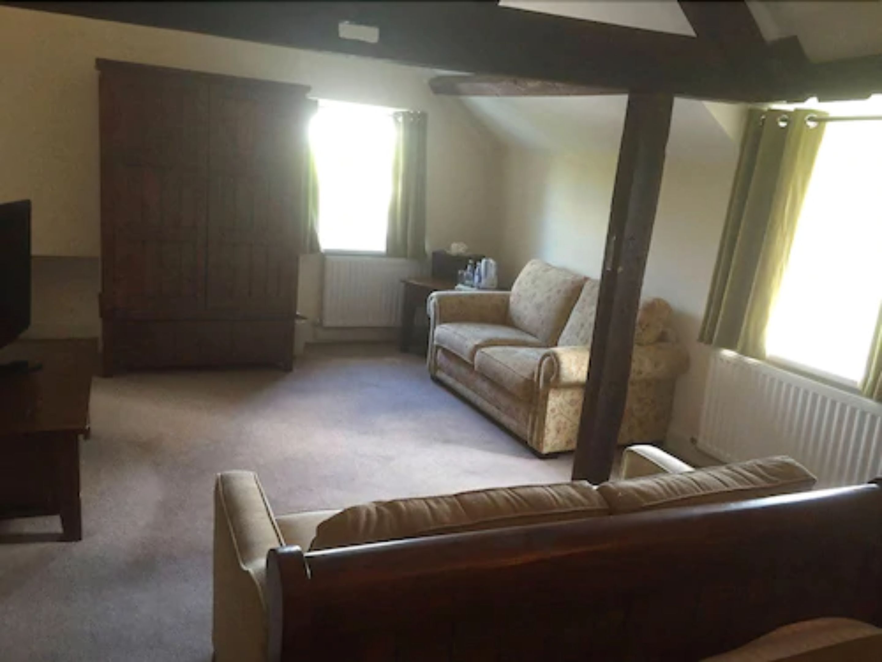 superior suite | living area | 32-inch flat-screen tv with satellite channels, tv, netflix