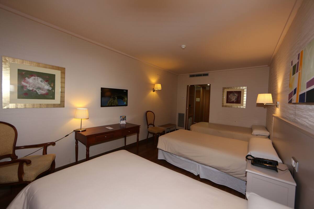 Triple Room | Desk, blackout drapes, soundproofing, iron/ironing board (on request)