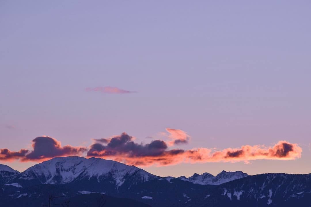 A mountain range with a sunset sky.