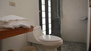 Signature Room | Bathroom | Shower, rainfall showerhead, towels, soap