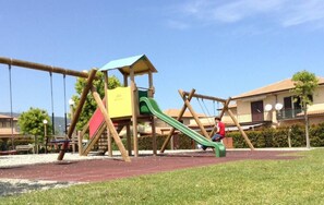 Children’s area - APARTMENT IN A RESIDENCE WITH A SWIMMING POOL AND A TREE-LINED SQUARE WITH A BEAUTIFUL VIEW OF MOUNT ETNA (Fondachello)