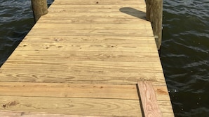 A wooden pier extending into calm water with a clear sky above. - *** NEWLY RENOVATED**** Escape to a Beautiful Getaway on the Chesapeake Bay (Perryville)