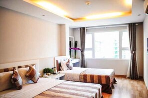 Chambre Triple Supérieure | Minibar, bureau, fer et planche à repasser, Wi-Fi gratuit
