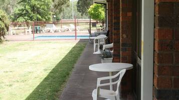 Queen and 2 Singles Room | Terrace/patio