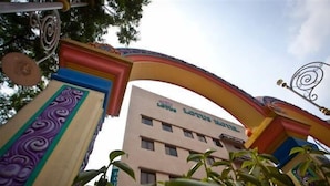 The exterior of the Lotus Hotel with a colorful archway and a sign indicating the name. - Lotus Hotel KL Sentral (Kuala Lumpur)