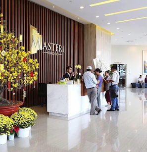 Welcome to Masteri Thao Dien, where guests can check in and enjoy a warm atmosphere amidst lush greenery and elegant decor.