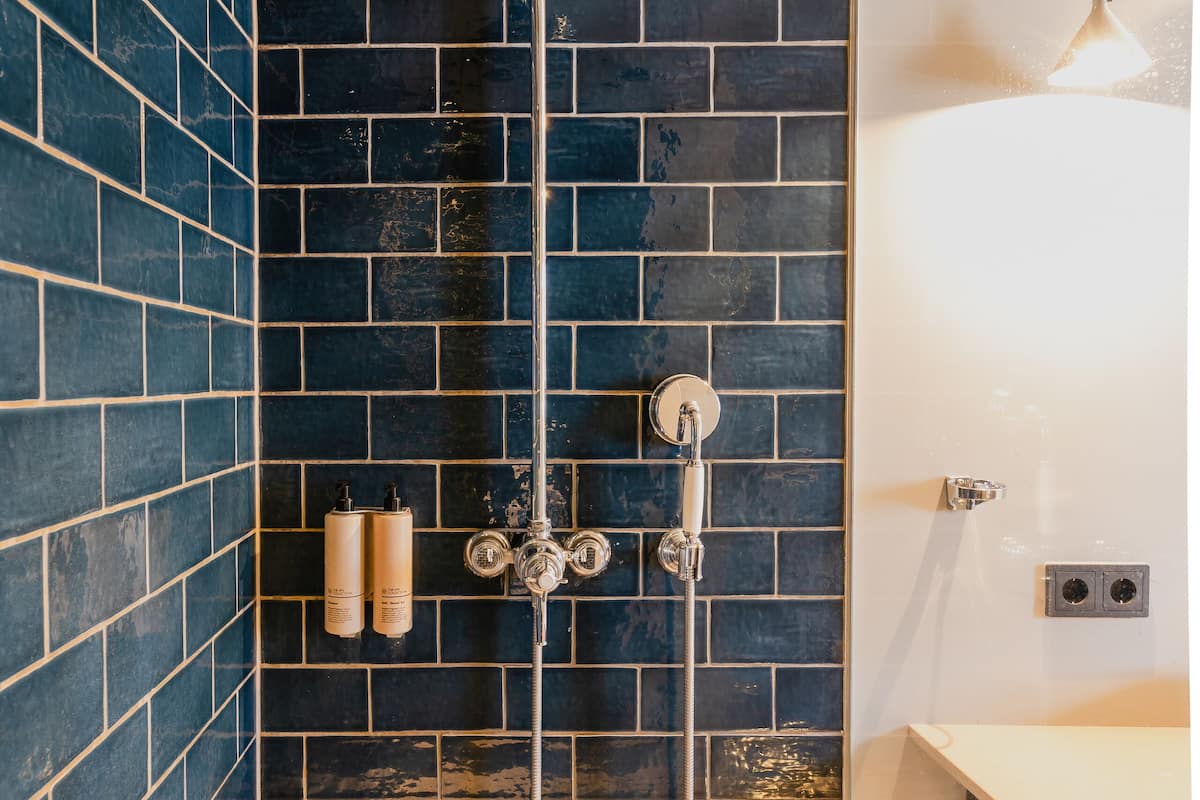 comfort quadruple room, multiple beds | bathroom | shower, free toiletries, hair dryer, towels