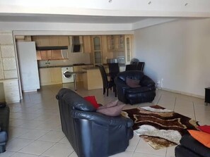 Apartment, 1 Bedroom, Kitchen | Living area | 42-inch flat-screen TV with cable channels, TV