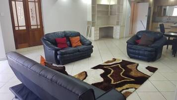 Apartment, 1 Bedroom, Kitchen | Living room | 42-inch flat-screen TV with cable channels, TV