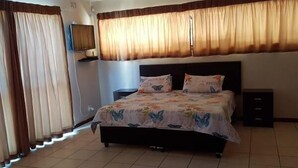Apartment, 1 Bedroom, Kitchen | 1 bedroom, desk, blackout drapes, iron/ironing board