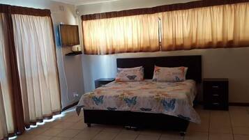 Apartment, 1 Bedroom, Kitchen | 1 bedroom, desk, blackout drapes, iron/ironing board