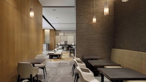 A modern interior with seating arrangements and pendant lighting. - Courtyard By Marriott Kyoto Shijo Karasuma (Kyoto)