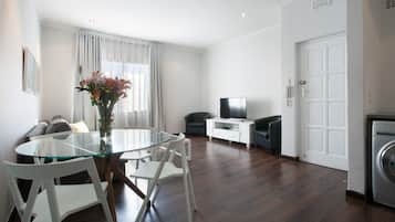 Apartment (1 Bedroom) | Living room | Flat-screen TV