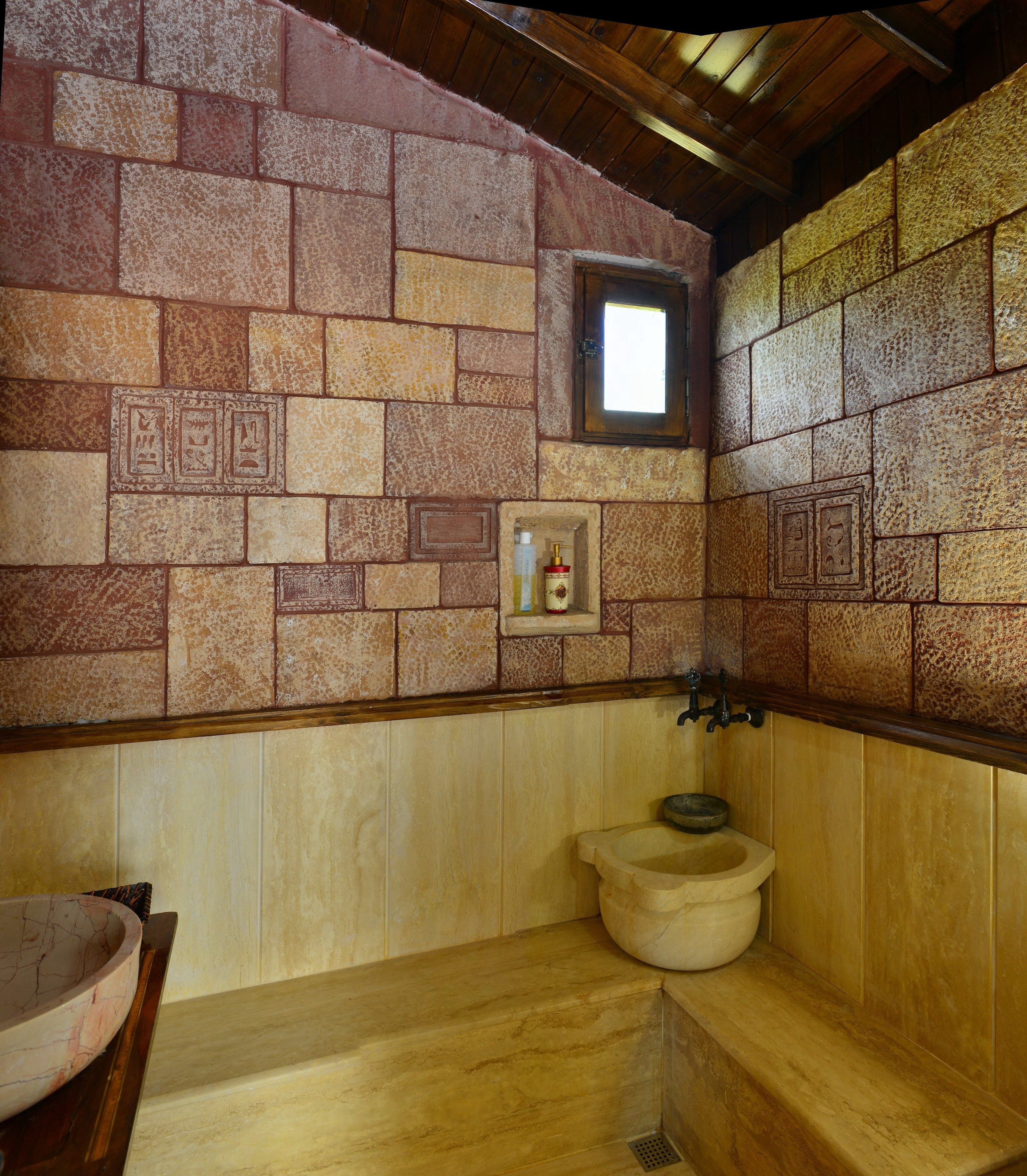 designer toiletries, hair dryer, slippers, towels