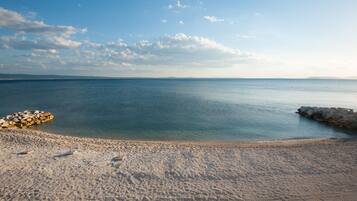 On the beach, sun loungers, beach umbrellas