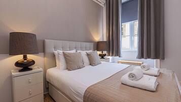 Apartamento família, 2 quartos, 2 banheiros, vista para a cidade | 1 quarto, individualmente decorados, individualmente mobiliados