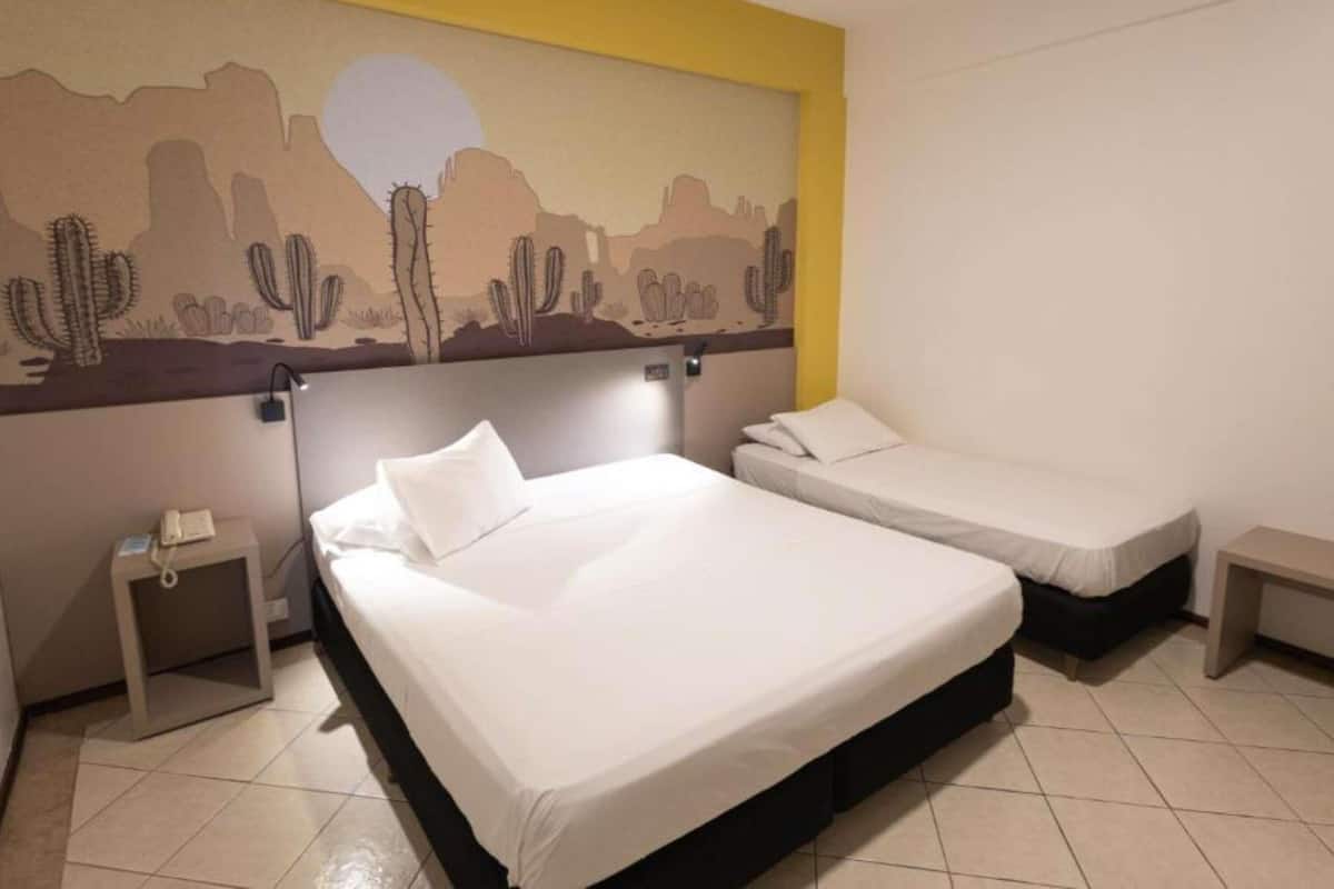 Standard Room, Multiple Beds | Minibar, free WiFi, bed sheets