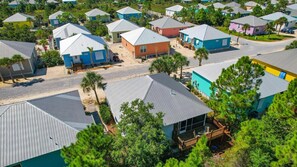 A residential area with houses featuring metal roofs and a mix of colors.