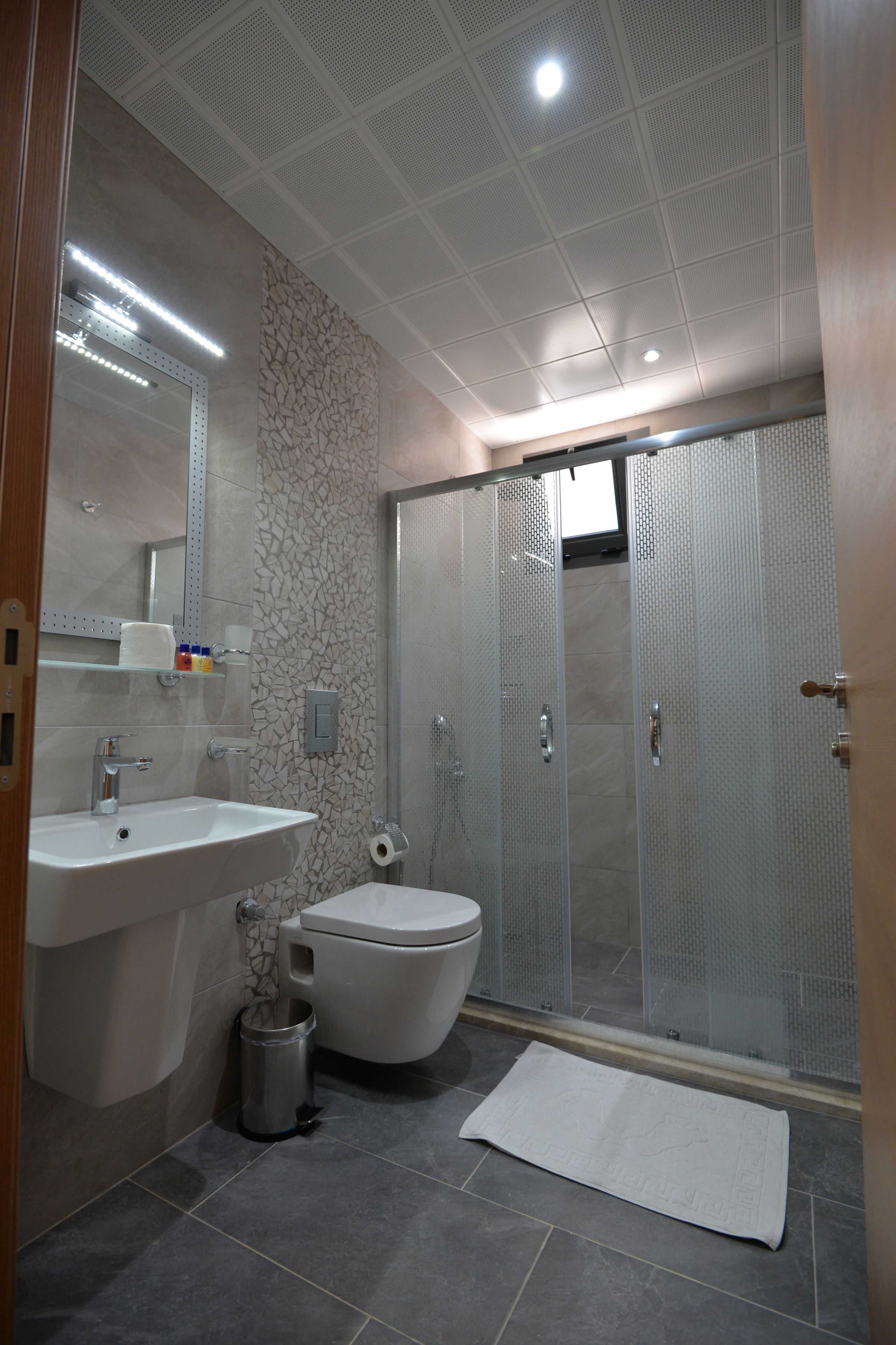 Shower, free toiletries, hair dryer, slippers