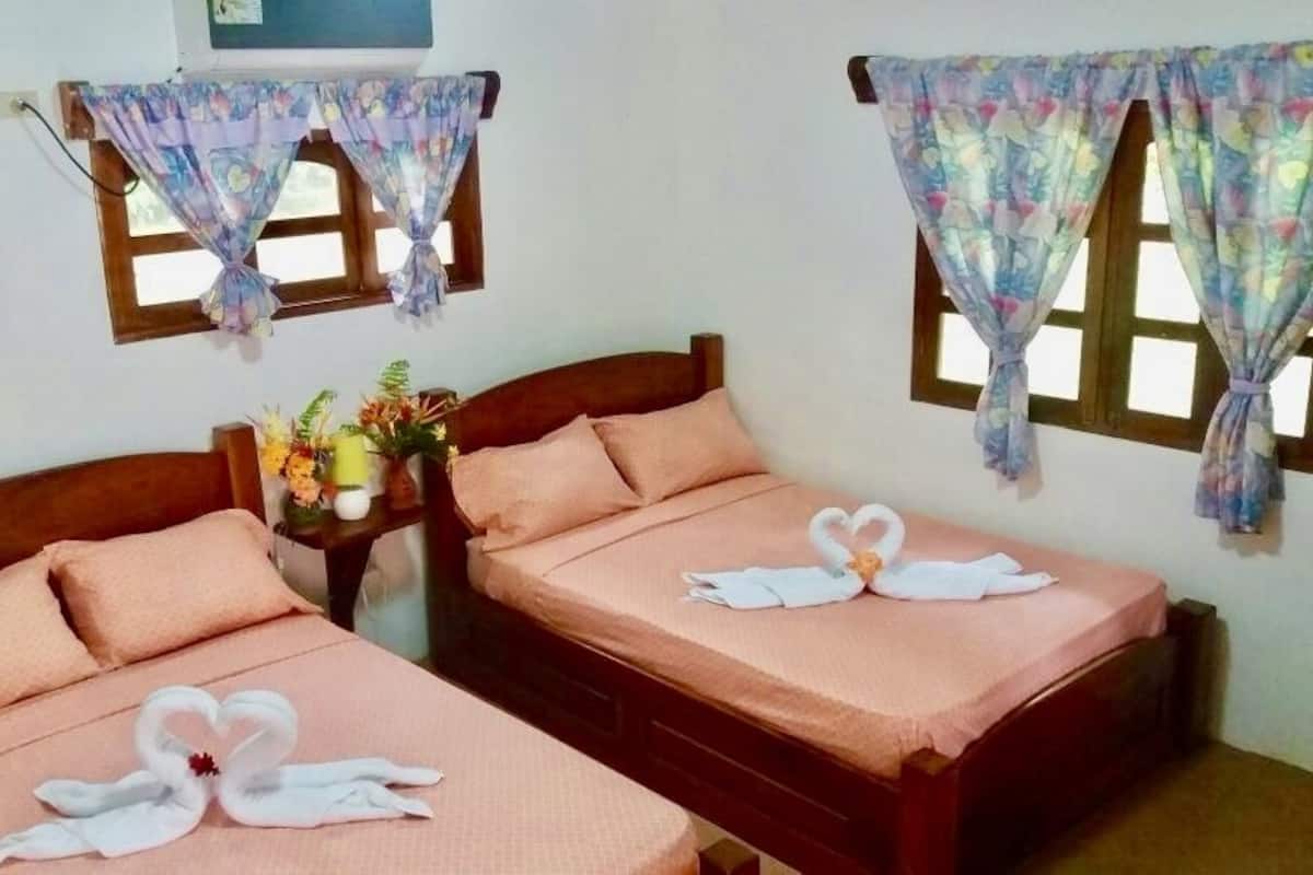 Family Room, 2 Double Beds, Garden View | Desk, blackout drapes, iron/ironing board, bed sheets