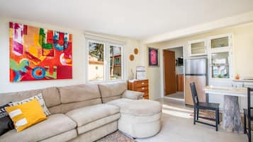 Suite, 2 Bedrooms | Living area | 32-inch TV with cable channels