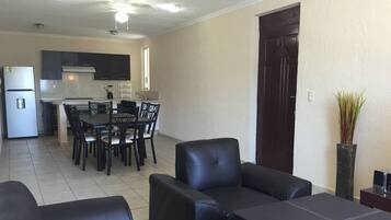 Apartment, 3 Bedrooms | Living area | 40-inch flat-screen TV with cable channels, TV