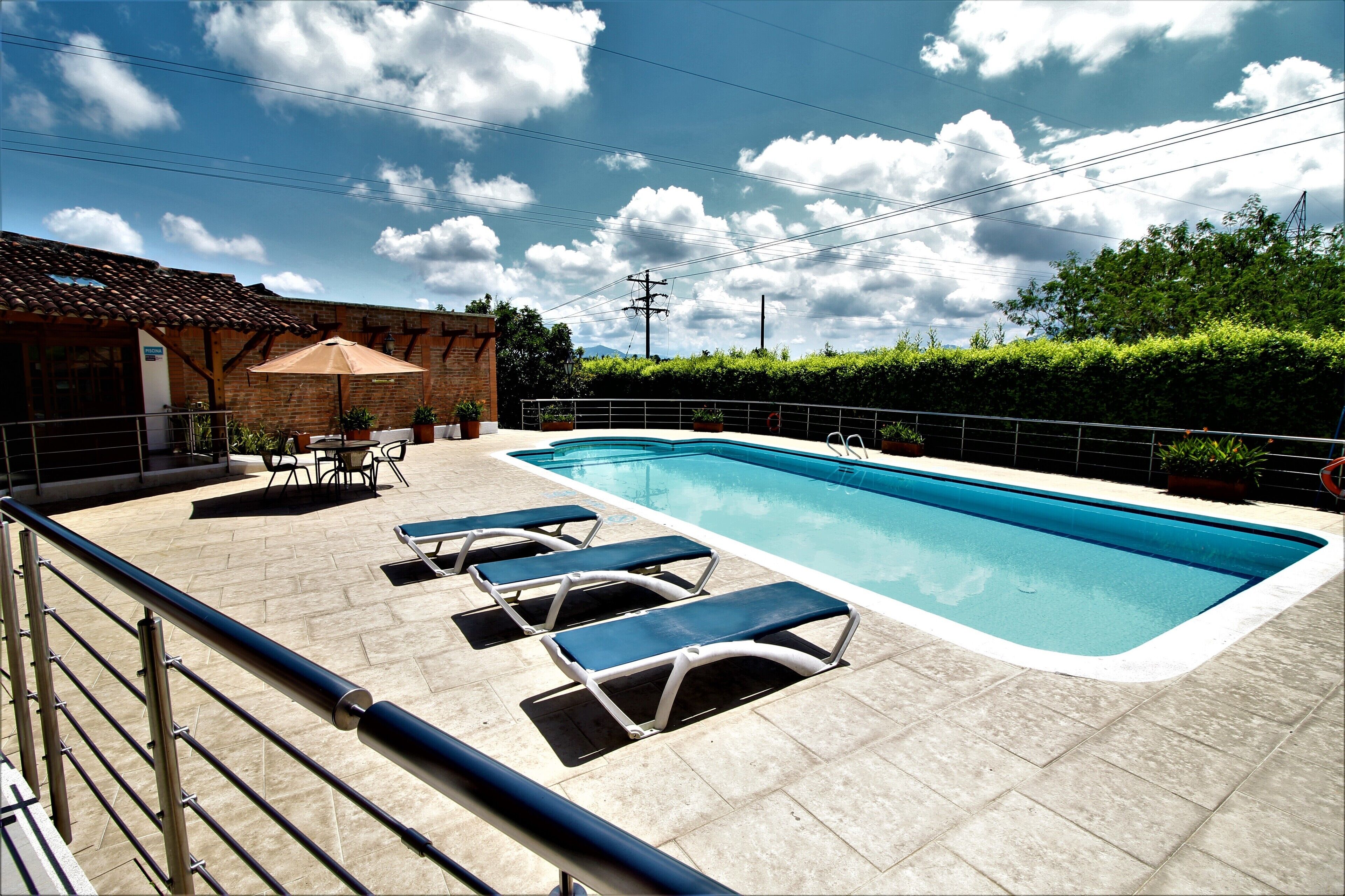 Outdoor pool, open 9 AM to 8 PM, sun loungers