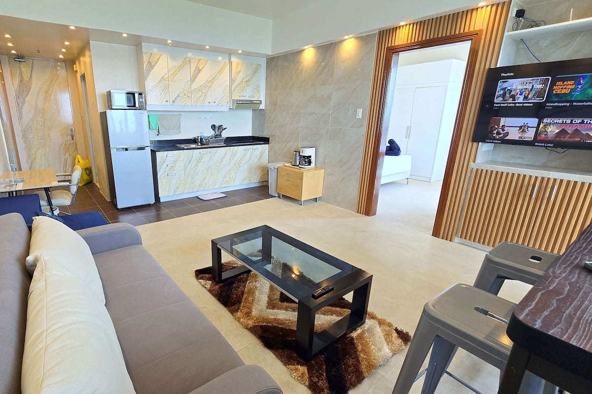 Premium Condo, 1 Bedroom, Ocean View, Oceanfront | Living area | 55-inch Smart TV with digital channels, TV, Netflix