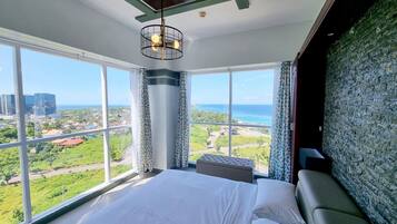 Luxury Condo, 2 Bedrooms, Ocean View, Beachfront | 2 bedrooms, down comforters, in-room safe, individually decorated