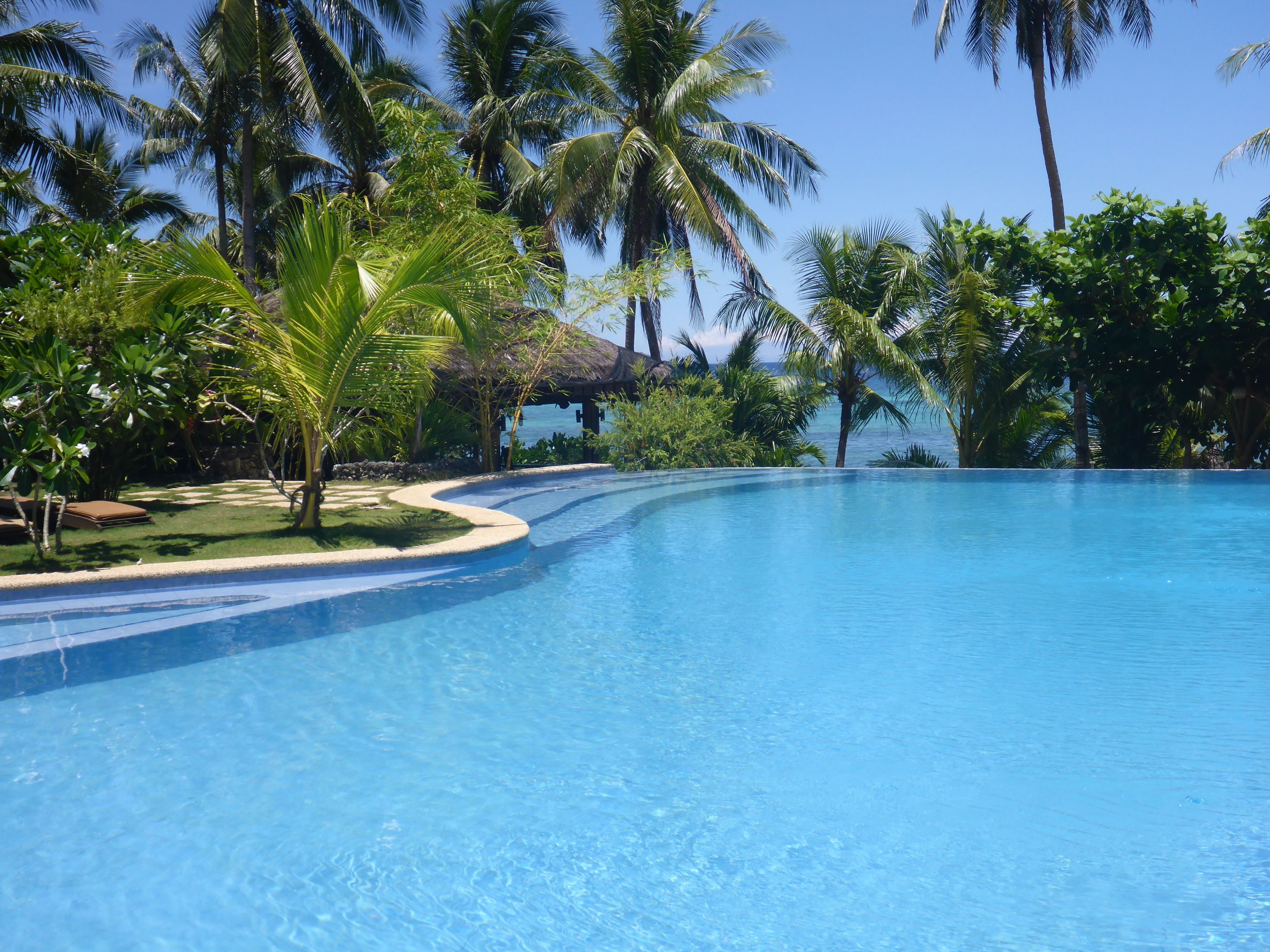 Outdoor pool, open 7 AM to 10 PM, sun loungers, lifeguards on site