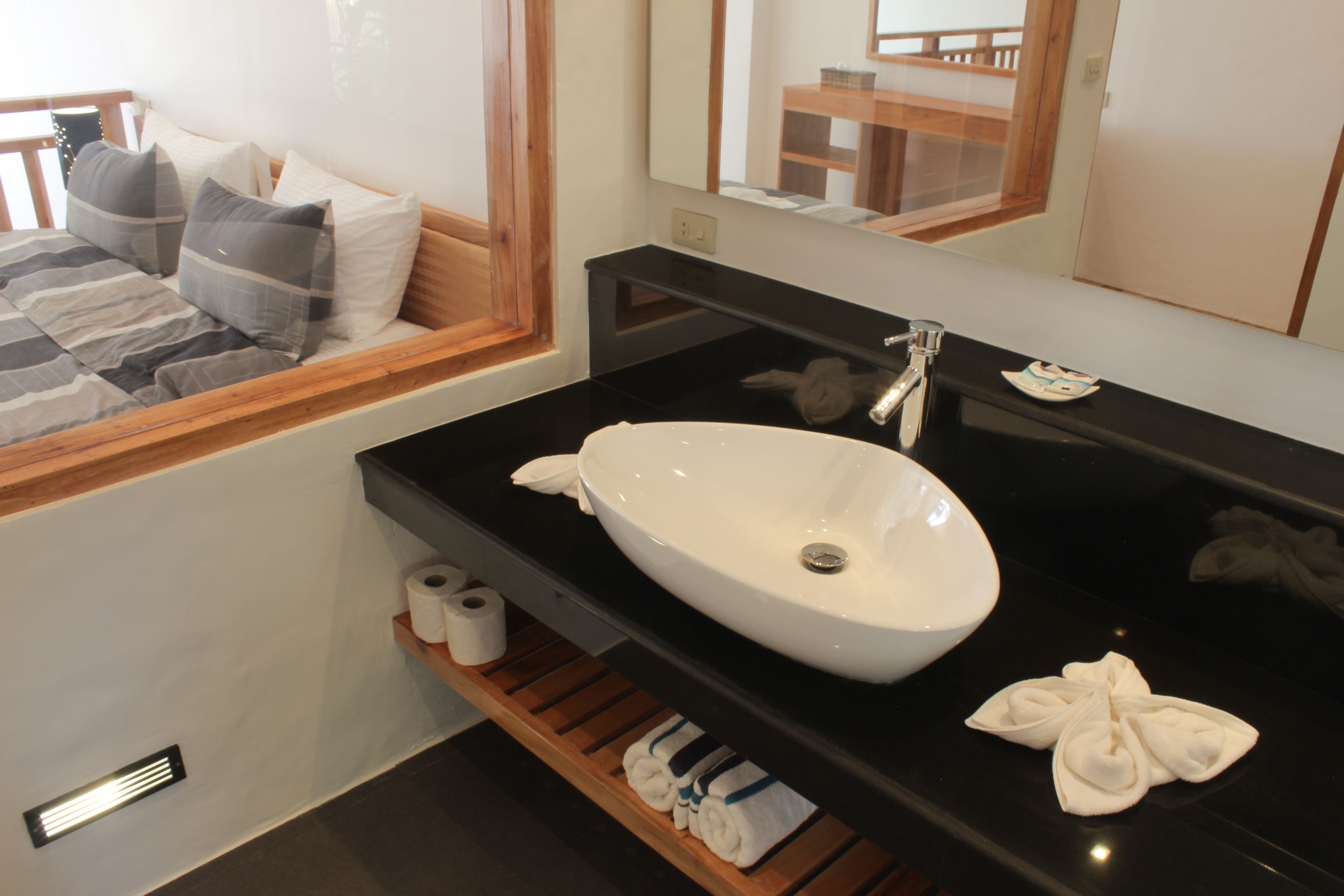 deluxe seaview suite | bathroom | shower, rainfall showerhead, eco-friendly toiletries, bidet