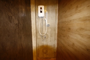 A shower with a handheld showerhead and a wall-mounted control panel. - Suanmaithara Resort (Chachoengsao)