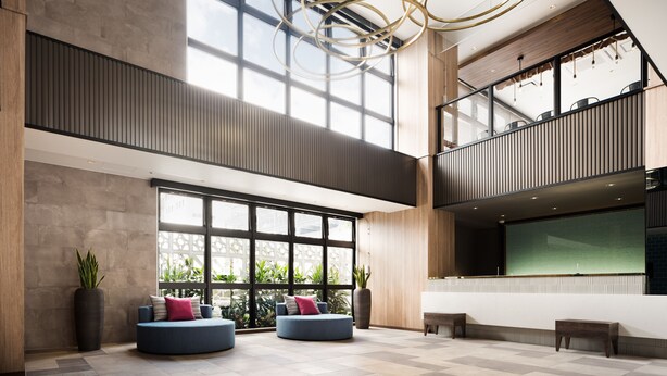A spacious lobby with large windows, a modern ceiling design, and seating areas. - Tissage Hotel Naha (Naha)