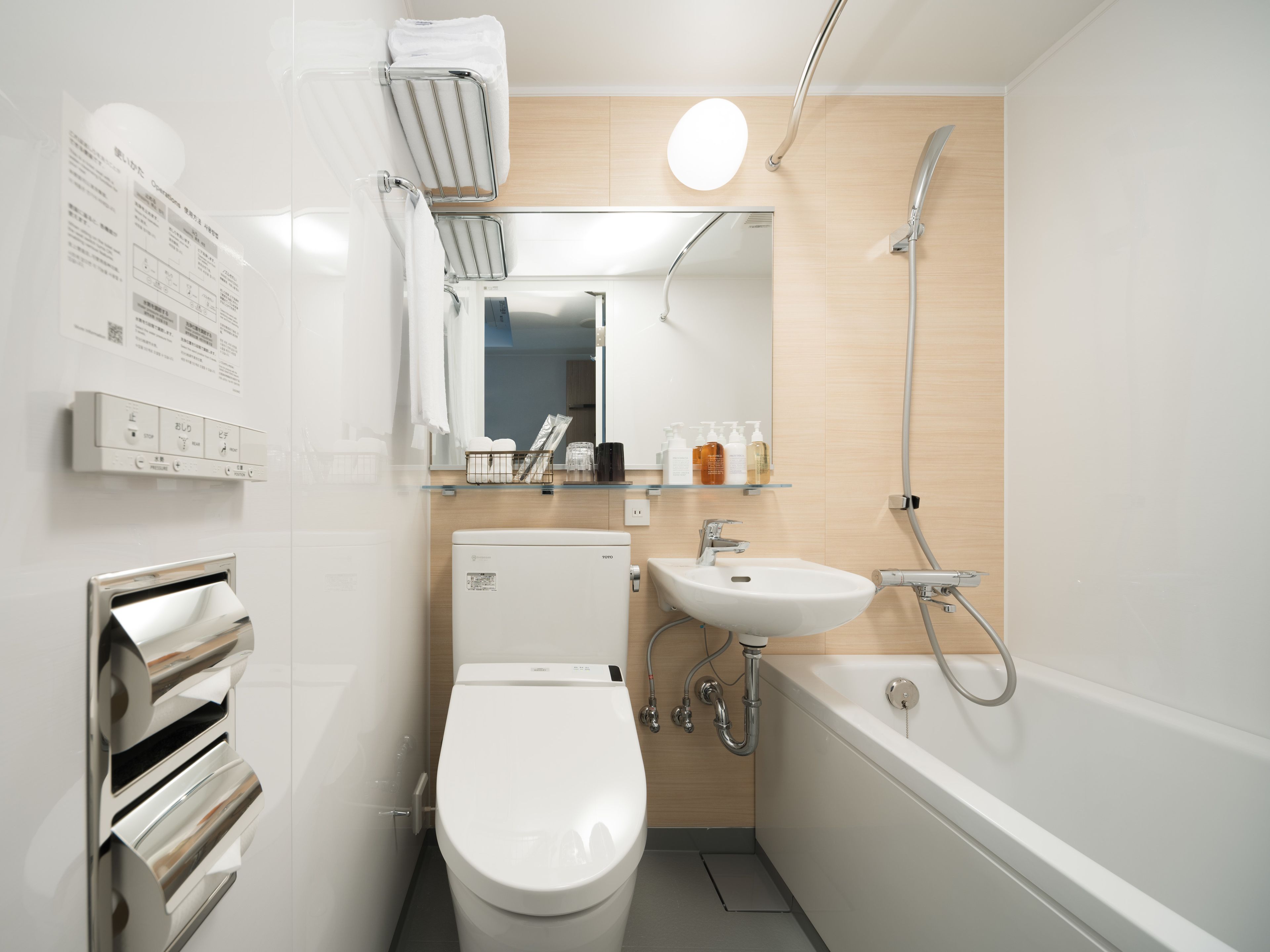 combined shower/bathtub, free toiletries, hair dryer, slippers